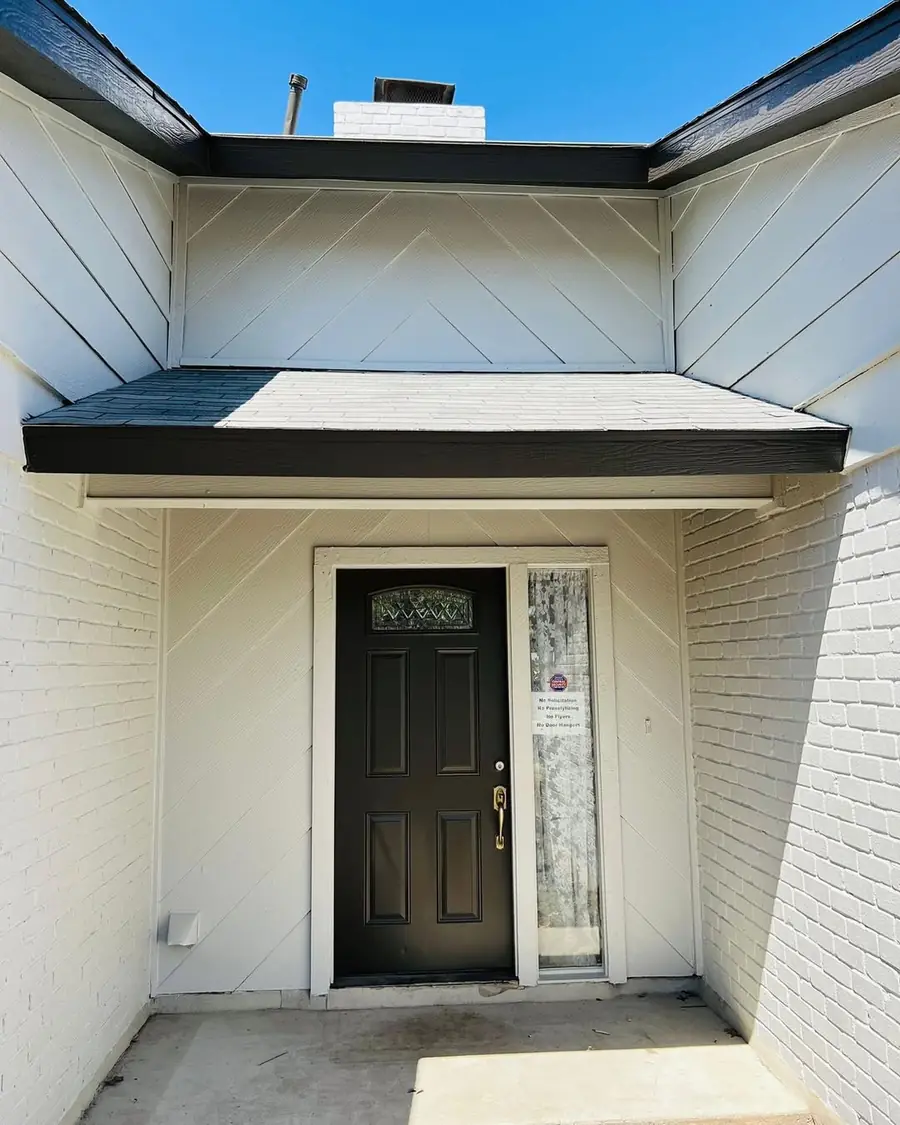 Front entry after New Life Painting refreshed the exterior trim and black door