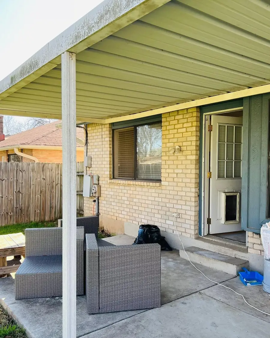 Covered patio before New Life Painting refreshed the exterior brick and trim